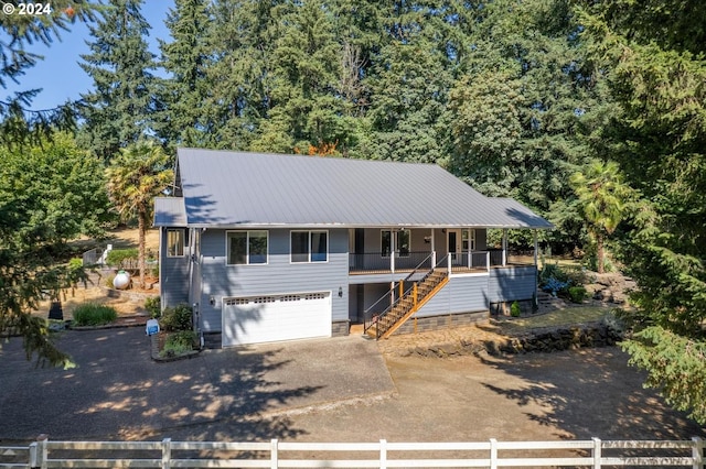 view of front of house with a garage and covered porch