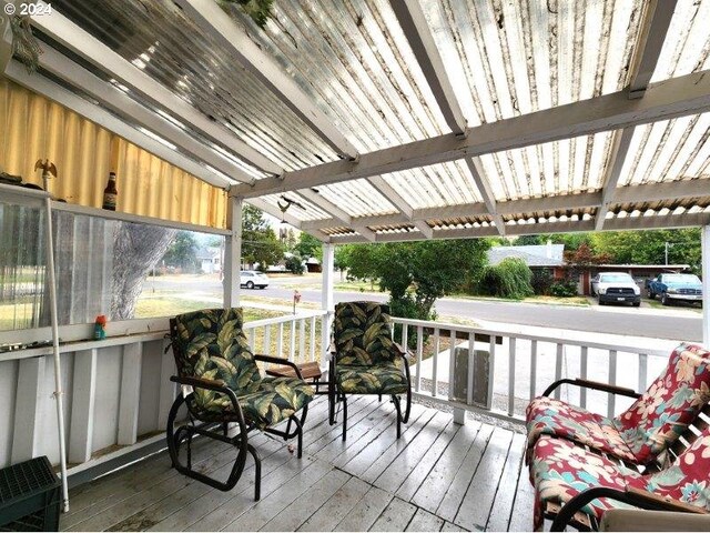 wooden terrace with a pergola