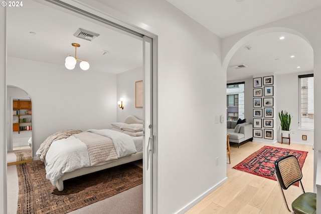 bedroom featuring light wood-type flooring