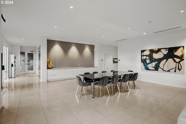 1150 NW Quimby St Unit 208, Portland, OR 97209 - dining area with dark aggregate flooring and recessed lighting