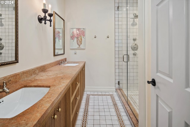 bathroom with vanity, a shower with shower door, and tile patterned floors