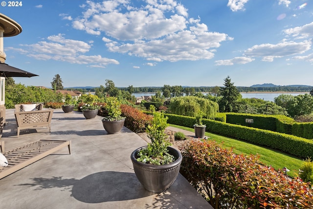 view of patio / terrace with a water view