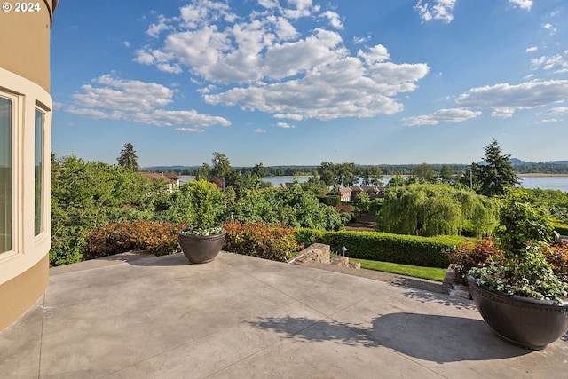 view of patio / terrace with a water view