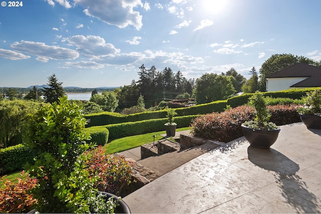 view of patio featuring a water view