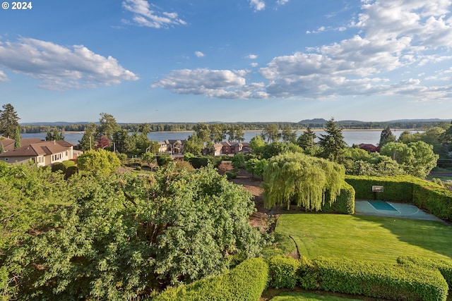 birds eye view of property with a water view