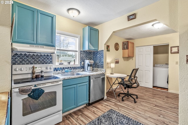 kitchen featuring blue cabinetry, electric range, stainless steel dishwasher, and washer / dryer