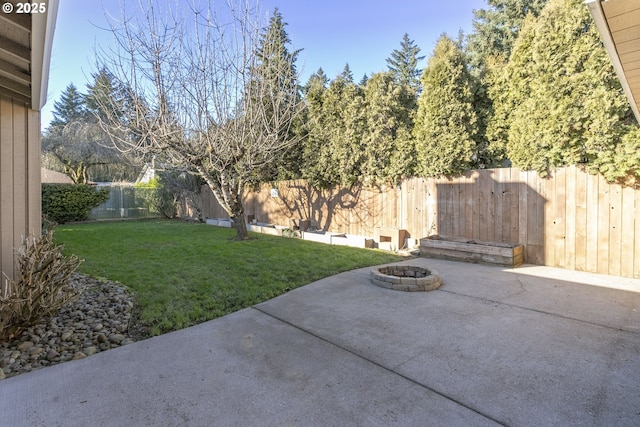 view of yard with a fire pit and a patio area