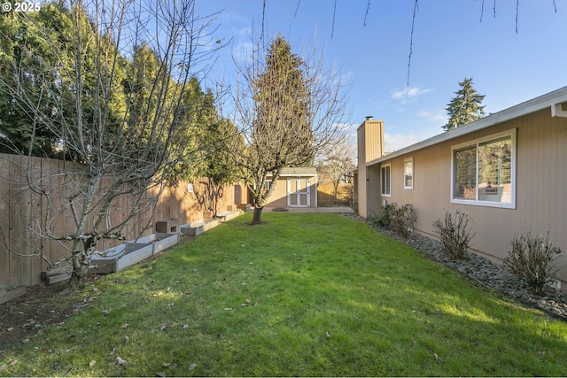 view of yard with a storage unit