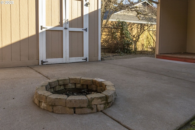 view of patio / terrace featuring an outdoor fire pit