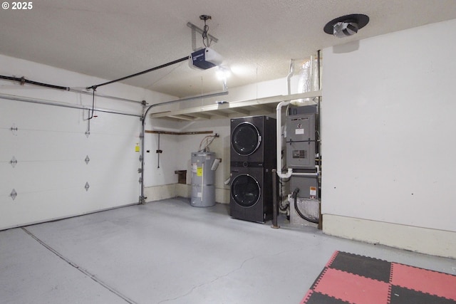 garage with a garage door opener, electric water heater, and stacked washer / dryer