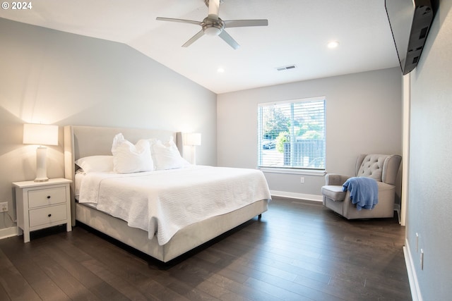 bedroom featuring ceiling fan, dark hardwood / wood-style flooring, and vaulted ceiling