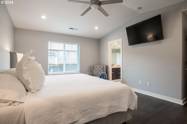 bedroom with connected bathroom, ceiling fan, dark wood-type flooring, and vaulted ceiling