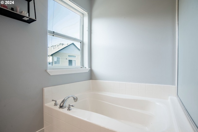 bathroom featuring tiled bath