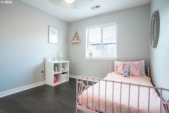 bedroom with ceiling fan and dark hardwood / wood-style floors