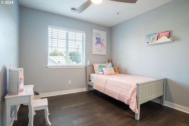 bedroom with dark hardwood / wood-style floors and ceiling fan