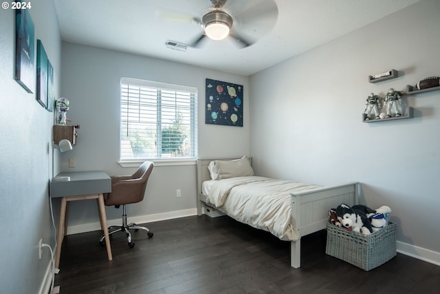 bedroom with ceiling fan and dark hardwood / wood-style floors