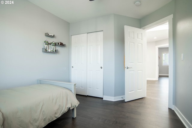 bedroom featuring a closet and dark hardwood / wood-style floors