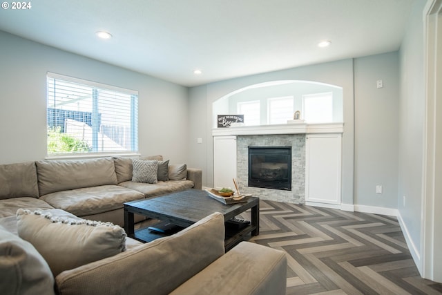 living room featuring dark parquet floors