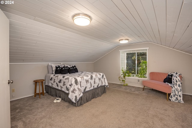 carpeted bedroom with lofted ceiling