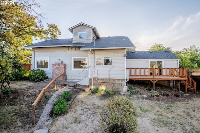 rear view of property with a deck