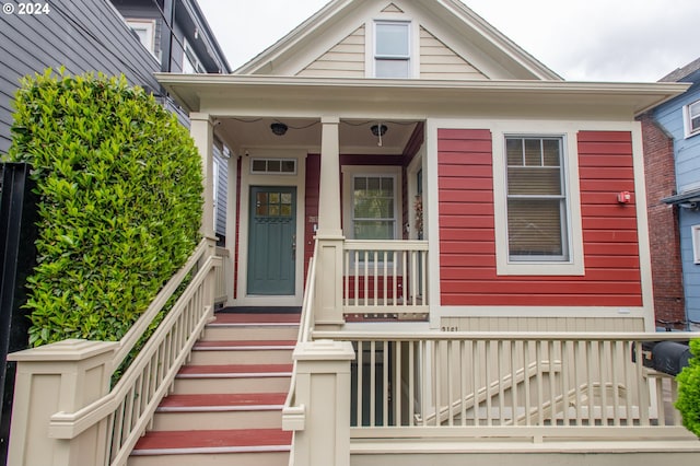 property entrance with covered porch