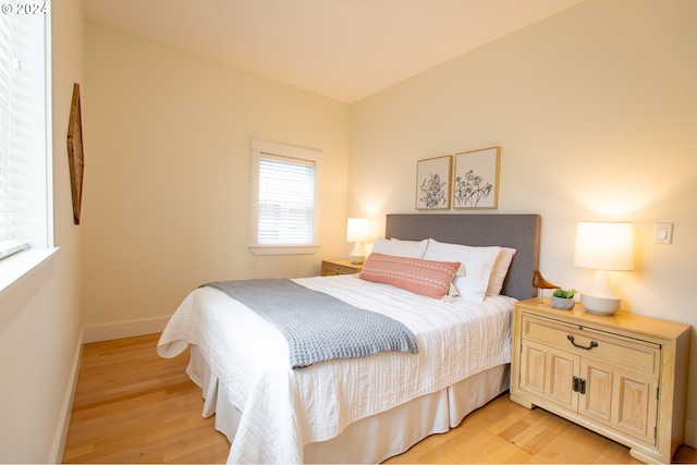 bedroom with light hardwood / wood-style flooring