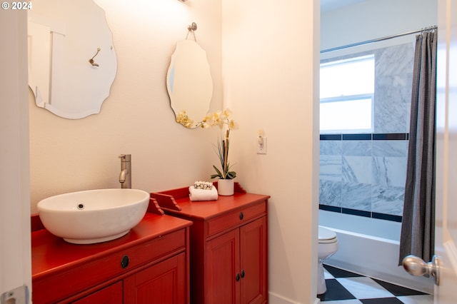 full bathroom with tile floors, vanity, shower / bath combo, and toilet