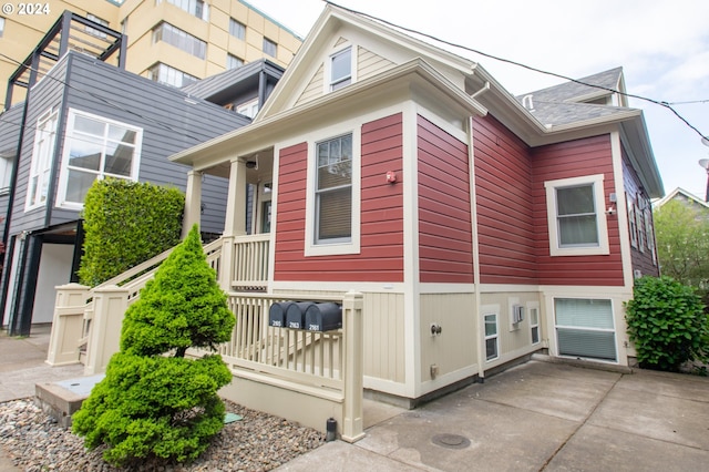 view of side of home with a patio area