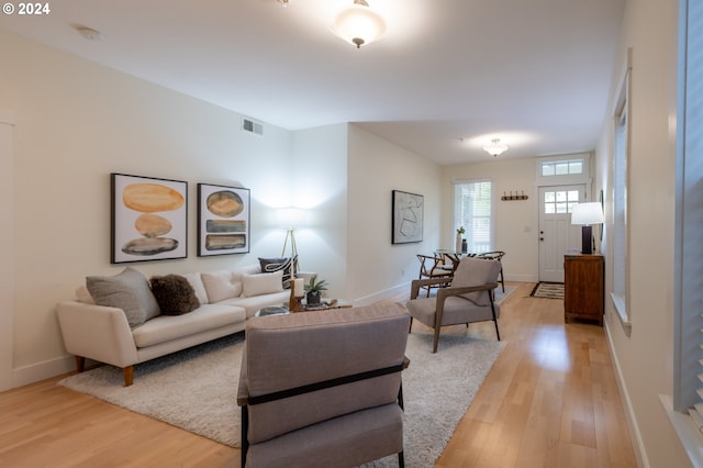 living room with light hardwood / wood-style floors