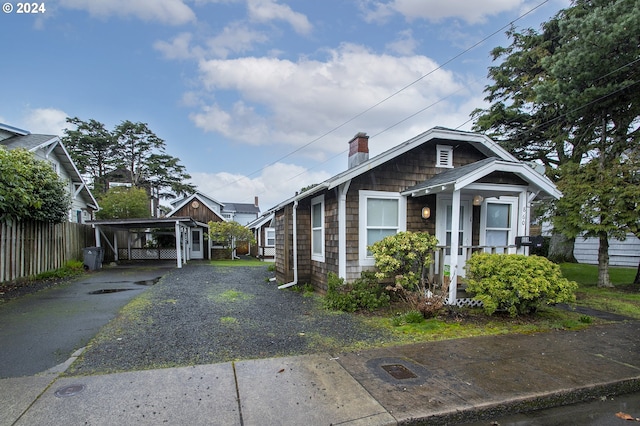 view of property exterior with a carport