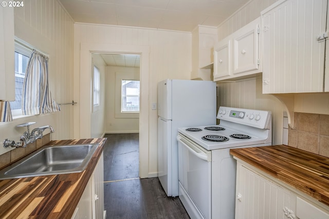 kitchen with dark hardwood / wood-style floors, white cabinets, white appliances, sink, and wood counters