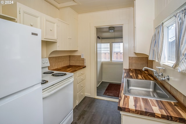 kitchen featuring wooden counters, white appliances, sink, dark hardwood / wood-style floors, and white cabinetry