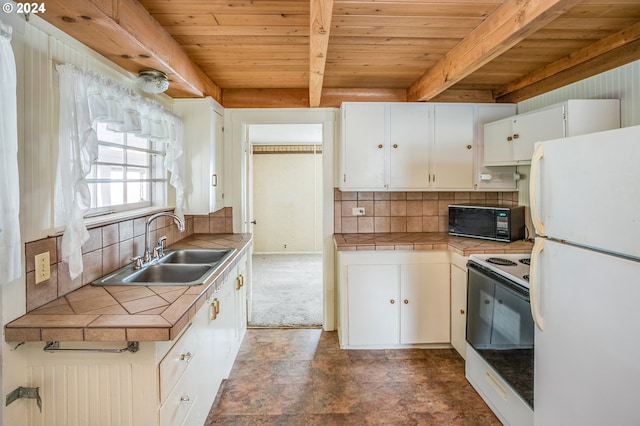 kitchen with tile countertops, white appliances, white cabinets, and sink