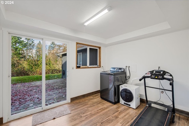 washroom featuring hardwood / wood-style flooring and washer / clothes dryer