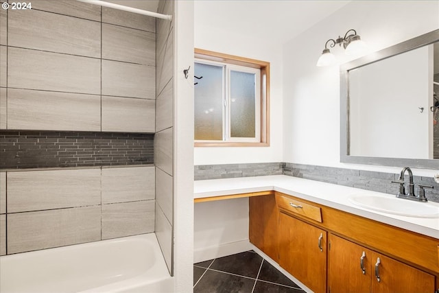 bathroom with vanity, tile patterned floors, and tiled shower / bath combo