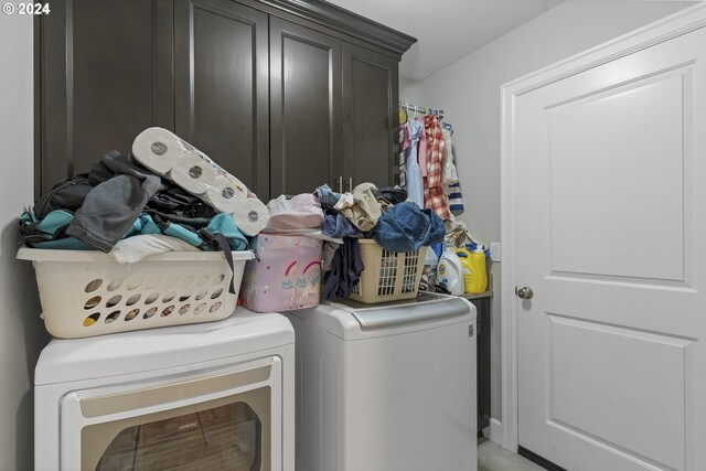 laundry area featuring cabinets and washer and dryer