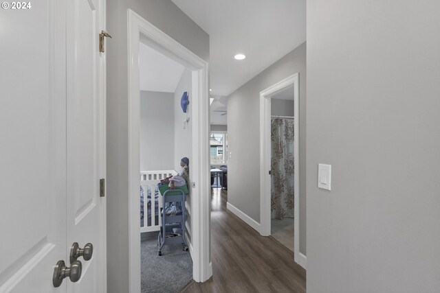 hallway with dark wood-type flooring