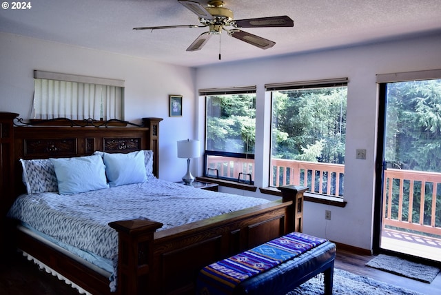 bedroom featuring hardwood / wood-style flooring, ceiling fan, access to exterior, and a textured ceiling