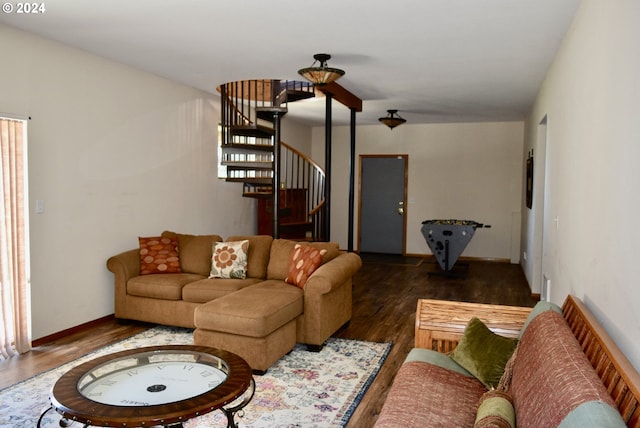 living room featuring dark wood-type flooring