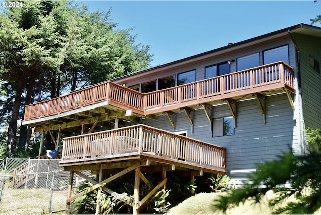 rear view of property with a deck