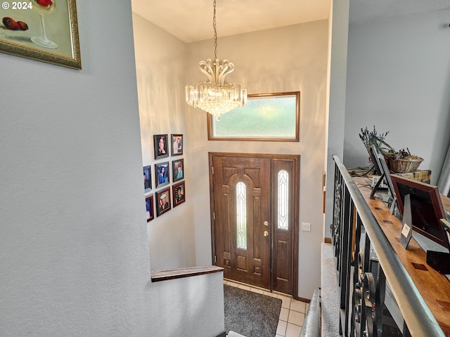 entryway featuring light tile patterned floors and a notable chandelier