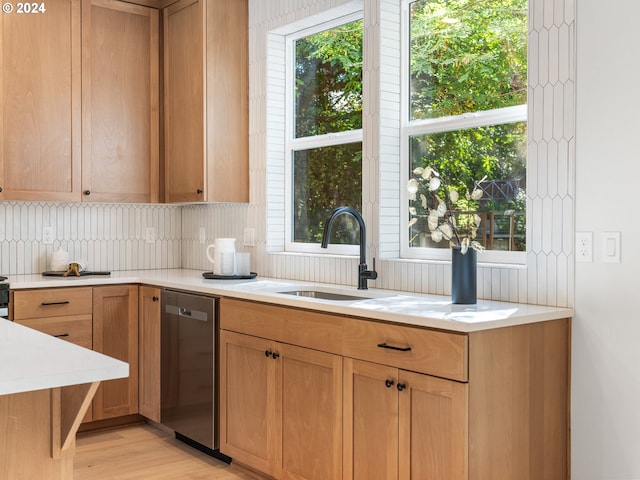 kitchen with decorative backsplash, dishwasher, light hardwood / wood-style flooring, and a healthy amount of sunlight