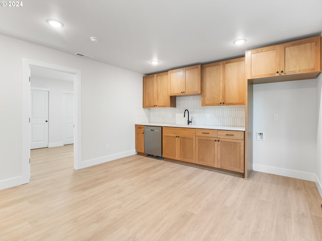 kitchen with light hardwood / wood-style flooring, sink, tasteful backsplash, and stainless steel dishwasher