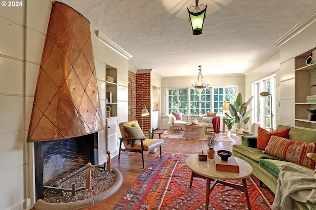 interior space featuring a textured ceiling, built in shelves, a premium fireplace, and crown molding