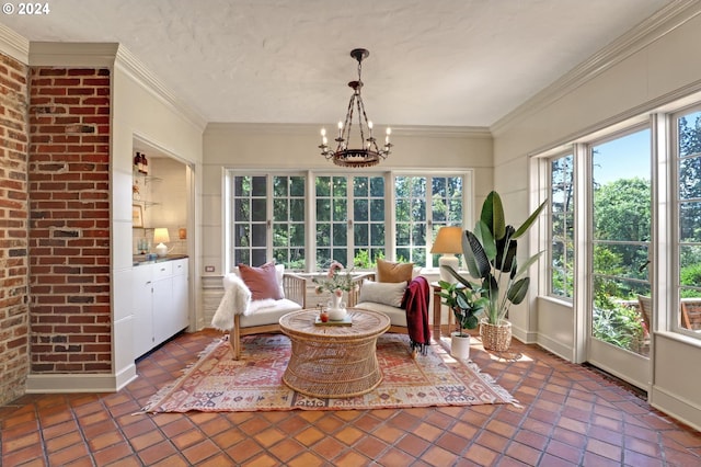 sunroom / solarium featuring a notable chandelier