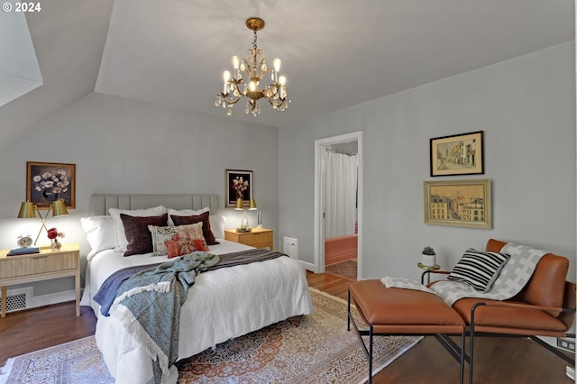 bedroom with vaulted ceiling, a chandelier, wood finished floors, and baseboards