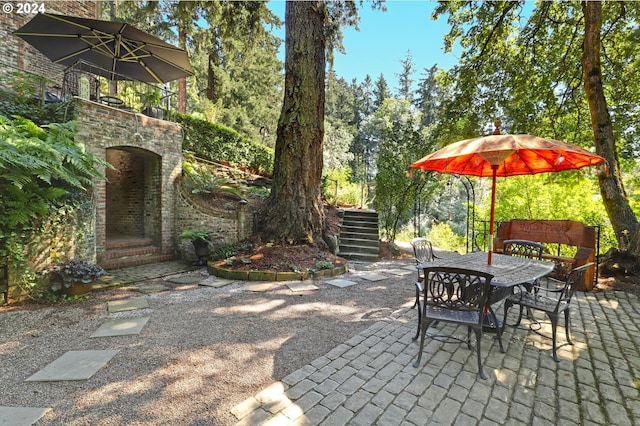 view of patio / terrace with stairs and outdoor dining area