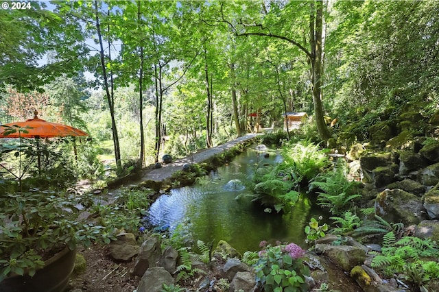 view of landscape with a forest view