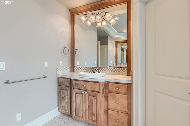 bathroom with decorative backsplash and vanity