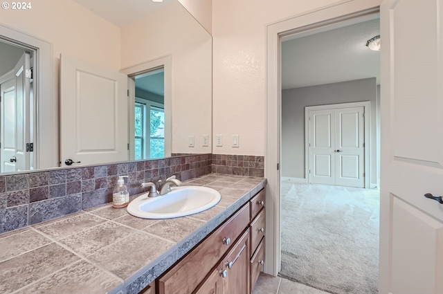 bathroom with vanity and backsplash